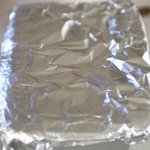 Cover dough with extended ends of foil.