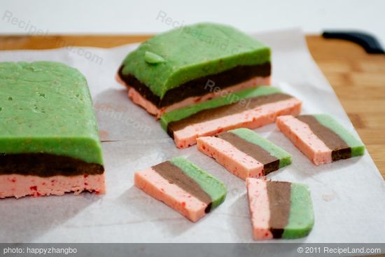 Cut dough crosswise into 1/4-inch slices; cut each slice into half.  