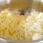 Shred the cheeses, then put them into a large bowl.