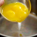 In a large sauce pan, add egg yolks,