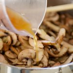 Pour stock into skillet.