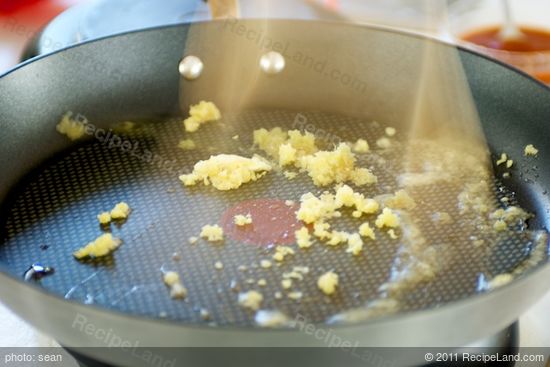 Heat a 14-inch flat-bottomed wok or large skillet over high heat until hot.