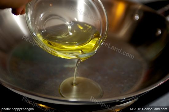 Next heat the olive oil over medium-high heat in a skillet until hot.