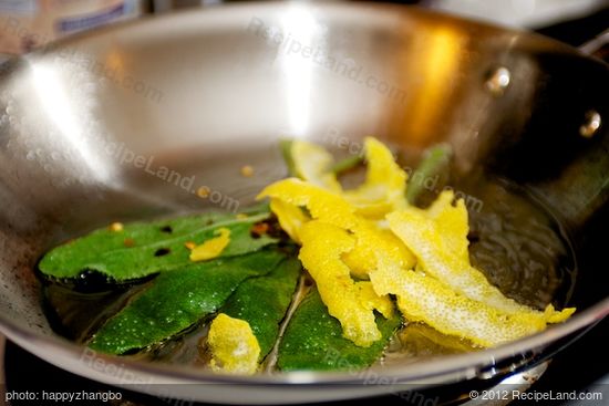 Add the sage leaves, lemon strips,