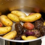 Cover the potatoes with salted cold water in a large pot.  