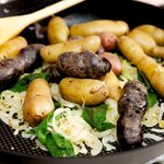 Add the boiled potatoes into the skillet.  