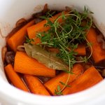 Add the carrots, bay leaf and thyme sprigs to the crock or pot.  