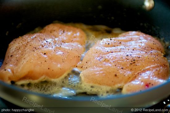 Add the chicken breasts into hot pan with bubbling butter.
