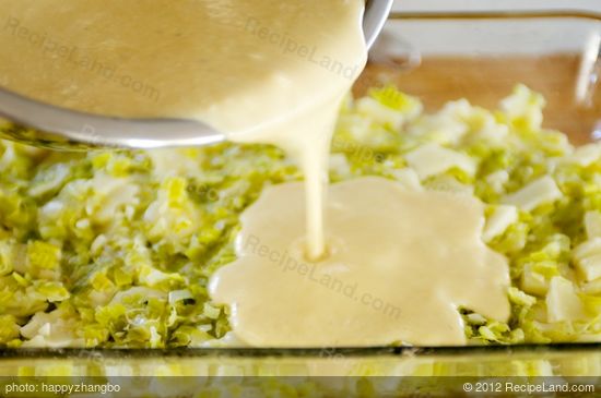 Pour into plate over leeks and cheese. 