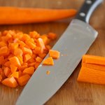 Peel and chop the carrots.