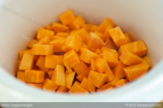 Add cubed sweet potatoes into crock pot.