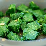 Add the frozen spinach into the pan, 
