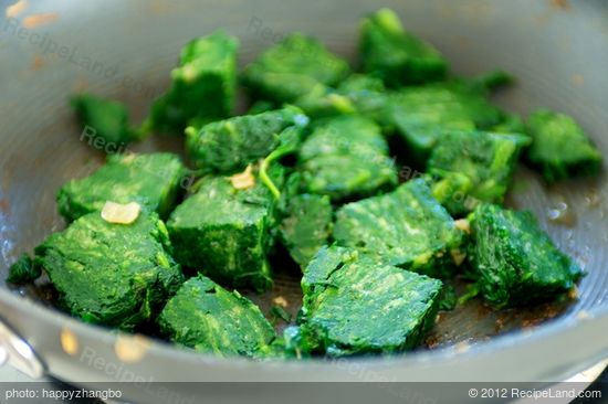 Add the frozen spinach into the pan, 