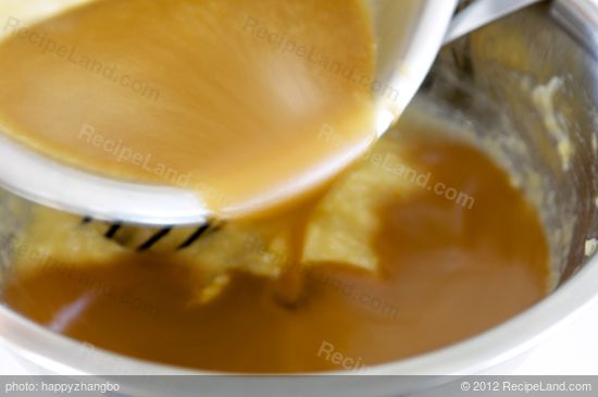 Pour the liquid mixture into mashed bananas. Stir well.