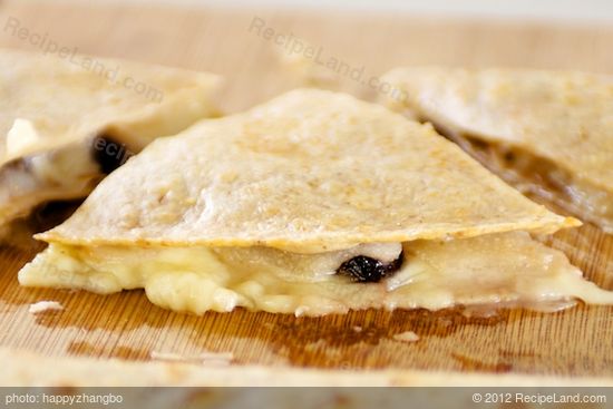 Cut each quesadilla into three wedges.