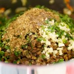 Add the garlic, lentils, cumin, coriander, cilantro and lemon juice. 