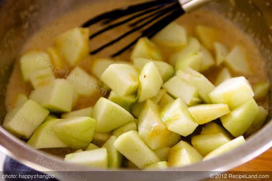 Add the apples into liquid mixture.
