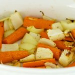 Return the roasting pan with the vegetables to the oven