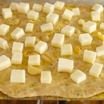 Scatter cheese cubes evenly on top.  