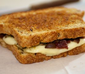 Caramelized Onion, Basil Pesto and Sun-Dried Tomato Grilled Cheese