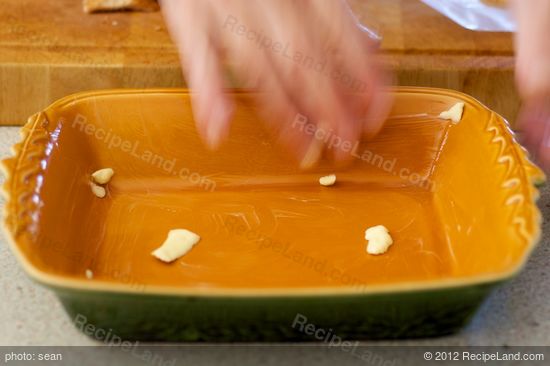 Lightly grease the dish with a small amount of butter. 