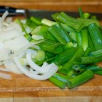 Thinly slice the onion and cut scallions into 2-inch pieces.