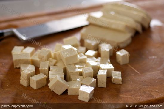 First let's cut the tofu into 1/2-inch cubes.
