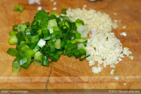 Meanwhile mince the garlic, ginger and slice the scallions.