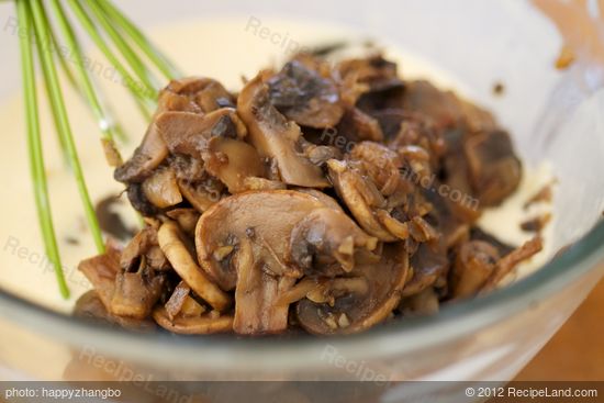 Add mushroom and onion mixture to egg mixture, stir until evenly mixed. 