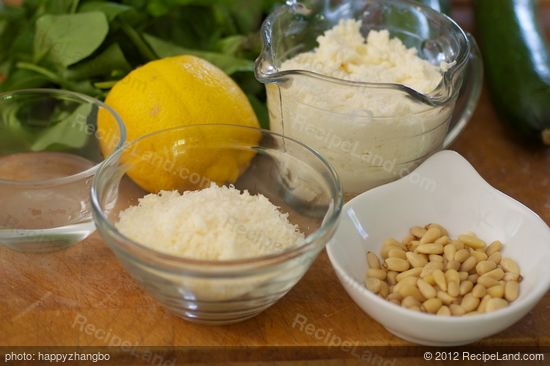 Next you need ricotta, parmesan cheese, lemon, a bit water and pine nuts.