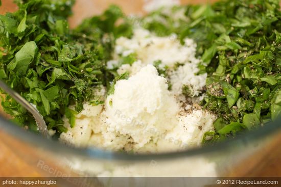 Add them all together except pine nuts in a large bowl.