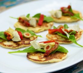 Fresh Corn Blinis with Roasted Bell Pepper, Artichoke Hearts and Arugula