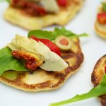 Fresh Corn Blinis with Roasted Bell Pepper, Artichoke Hearts and Arugula
