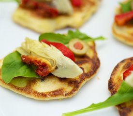 Fresh Corn Blinis with Roasted Bell Pepper, Artichoke Hearts and Arugula