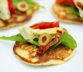 Fresh Corn Blinis with Roasted Bell Pepper, Artichoke Hearts and Arugula