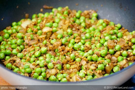 Stir in peas,