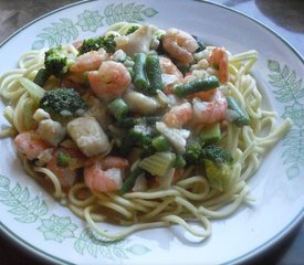 Shrimp and Fish with Green Vegetables in Orange Sauce