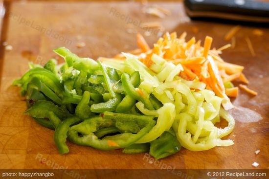 Prepare the carrot and peppers.