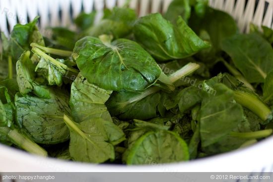 Stir in the tatsoi or spinach,
