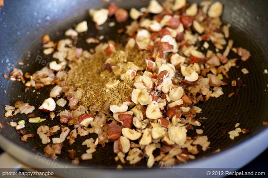 Add the cumin and hazelnuts.