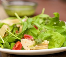 Arugula, Artichoke and Cherry Tomato  Salad with Pesto Vinaigrette