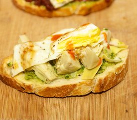 Artichoke Hearts, Basil Pesto and Fried Egg Crostini 