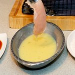 Dip the chicken into the egg mixture.