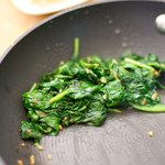 Transfer the spinach into a colander,