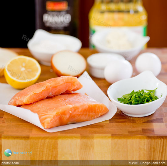 Ingredients for salmon cakes on a cutting board