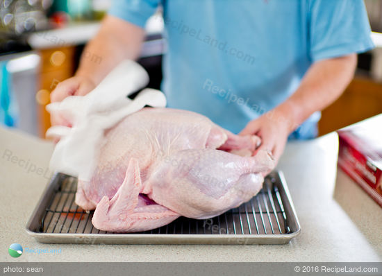 Pat the turkey dry with paper towels