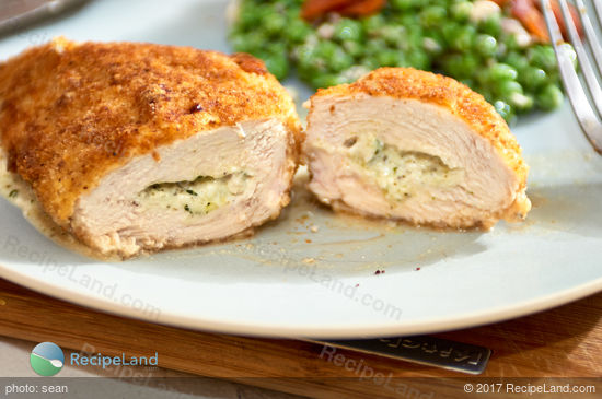 Stuffed chicken breasts with oozy gooey cream cheese and basil pesto. Common ingredients result in juicy chicken packed with flavor. Rich and low-fat rarely go together but this recipe delivers both!
