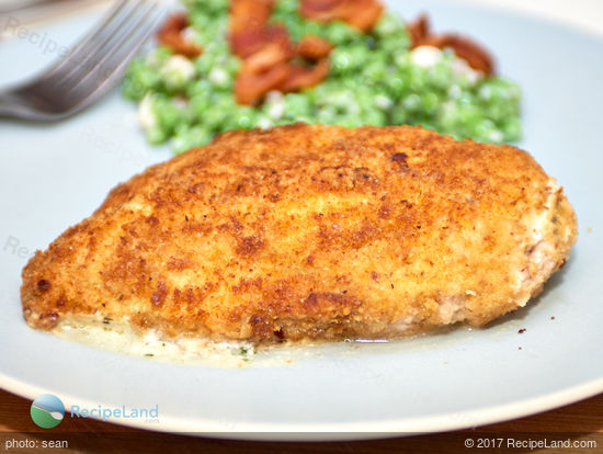 Stuffed chicken breasts with oozy gooey cream cheese and basil pesto. Common ingredients result in juicy chicken packed with flavor. Rich and low-fat rarely go together but this recipe delivers both!