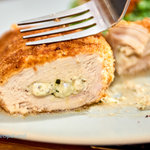 Stuffed chicken breasts with ooey gooey cream cheese and basil pesto. Common ingredients result in juicy chicken literally packed with flavor. Rich and low-fat rarely go together but this recipe delivers both!