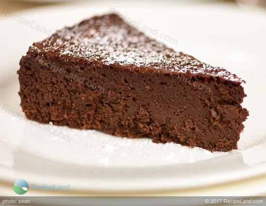 Close-up of a slice of Gluten-free Chocolate Mousse Passover cake on a white plate